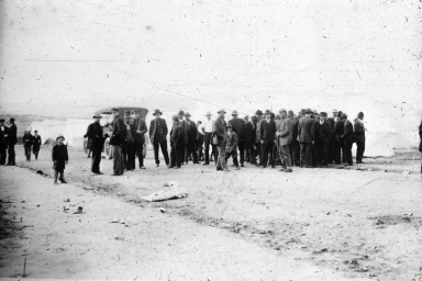 Miners outside tent colony