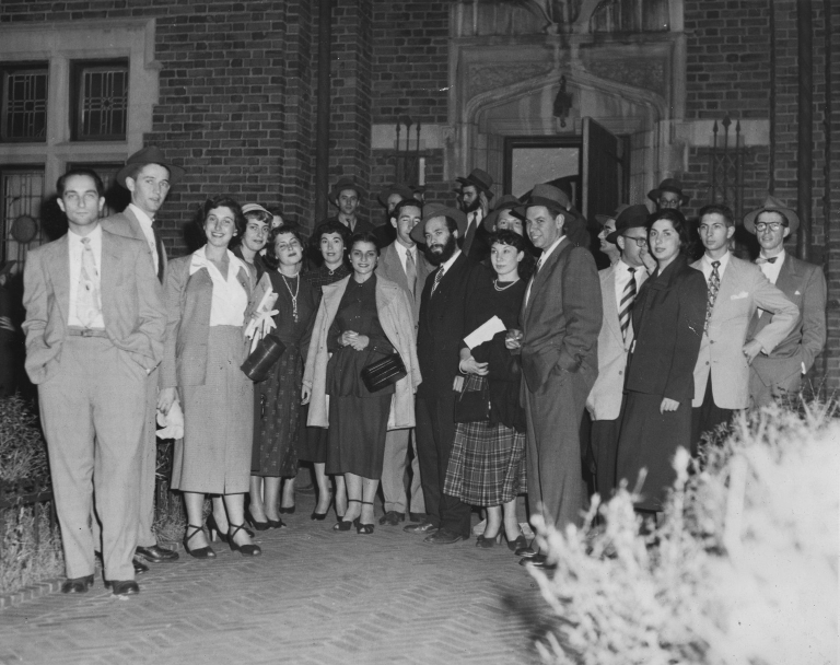 Rabbi Shlomo Carlebach (center) with a group that he brought to 770 Eastern Parkway, the headquarters of the Lubavitcher Hasidim in Crown Heights, Brooklyn, New York, ca. 1950.