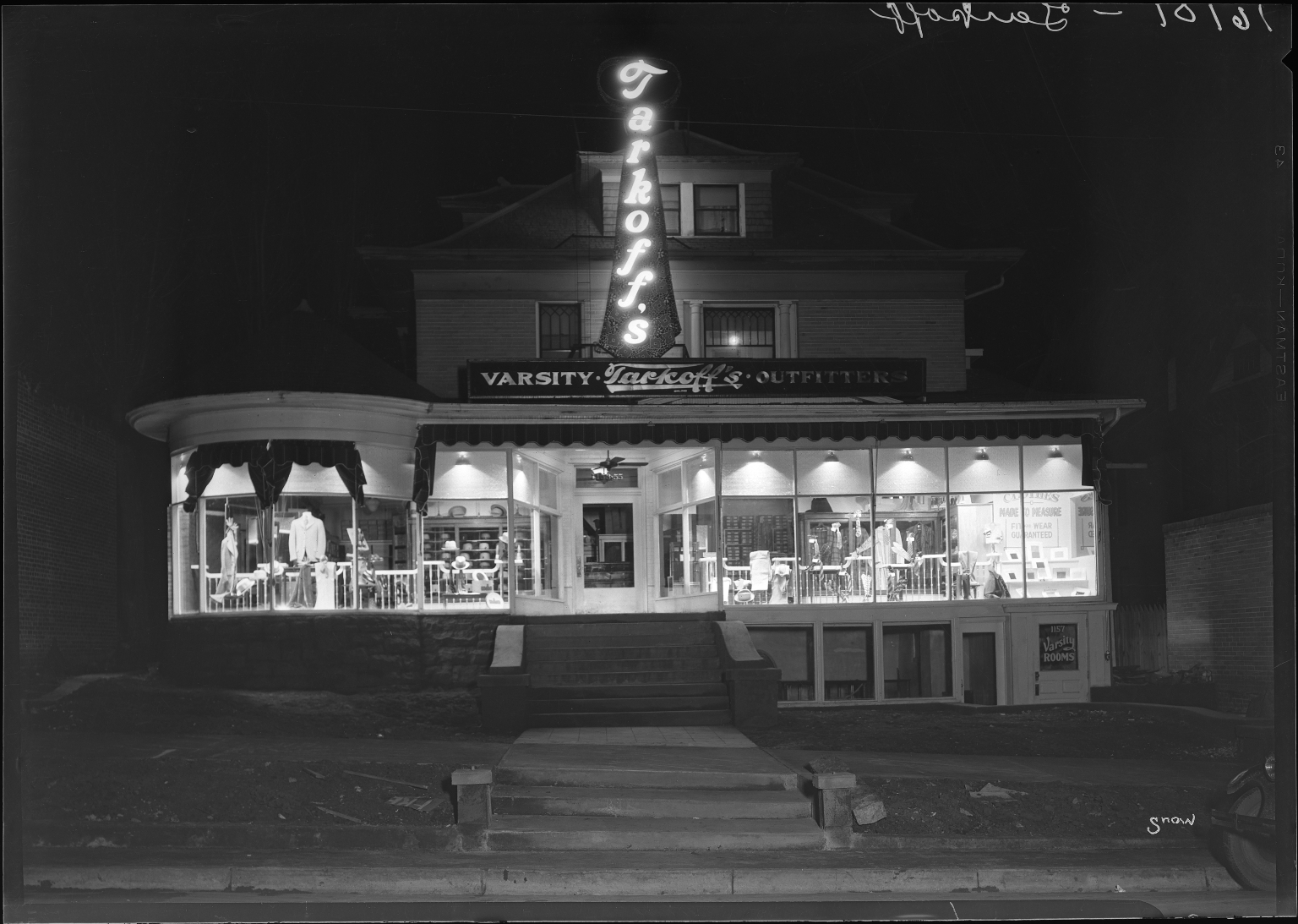 Tarkoff's Varsity Outfitters storefront during the day and night